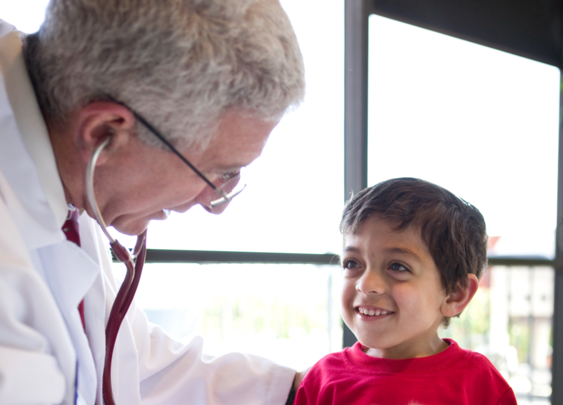 Photo of toddler with skeletal dysplasia signs at doctor appointment